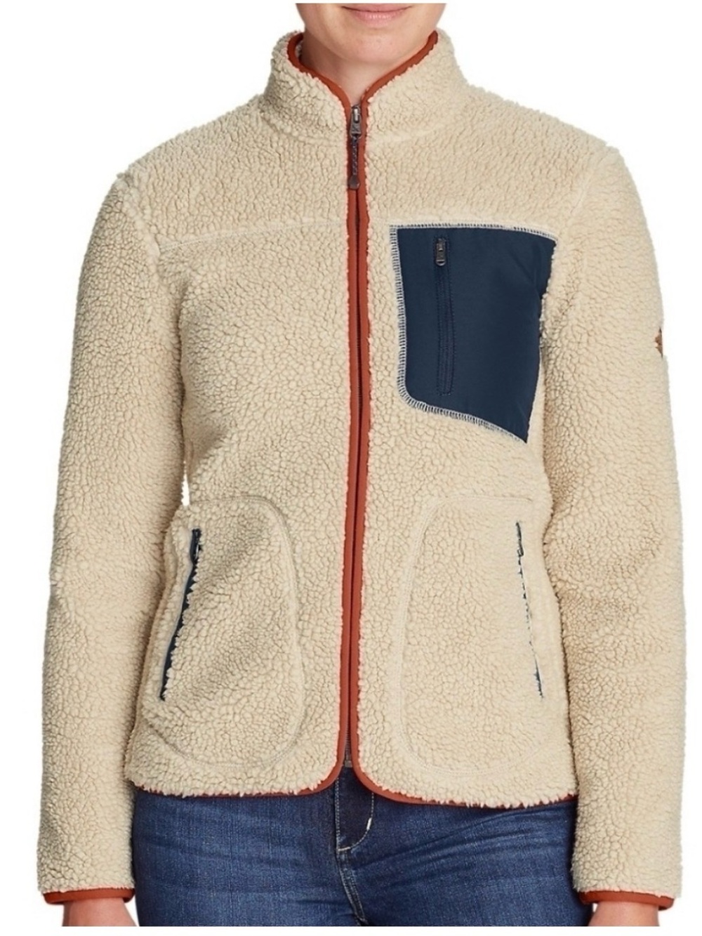 Eddie Bauer Cream Sherpa Jacket with Navy Pocket and Orange Trim.